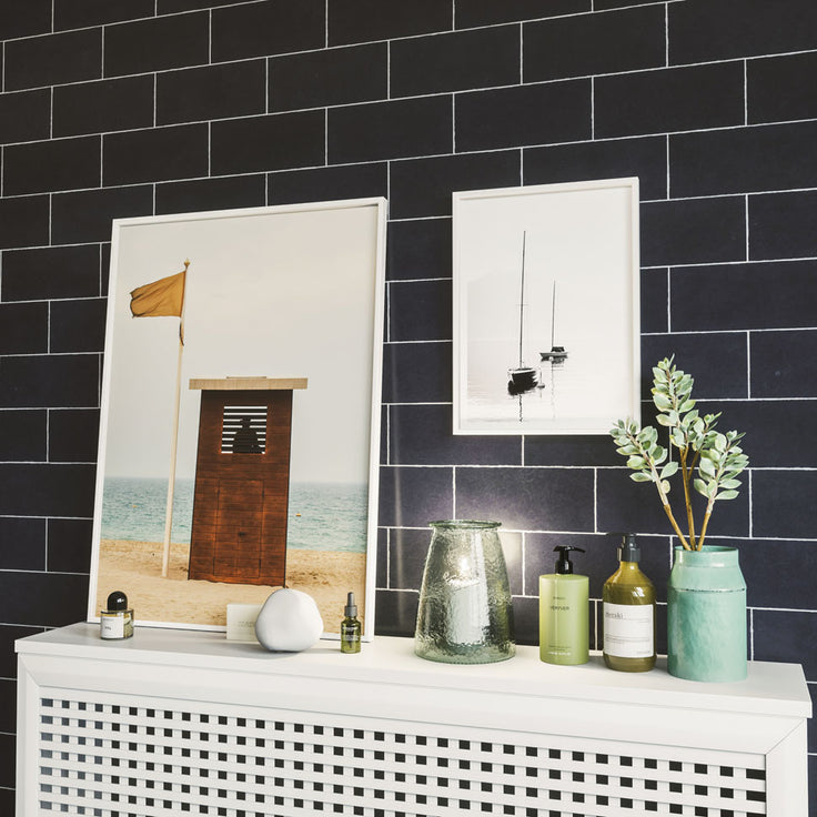 Kleine Bilderwand im Badezimmer